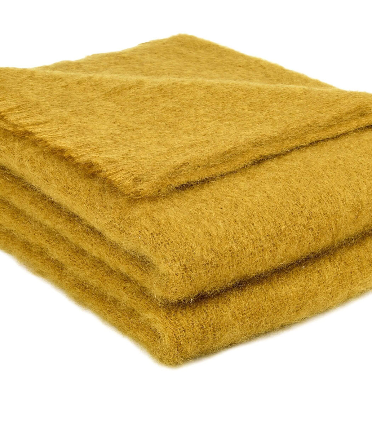 Détail du plaid mohair ambre doux, lumineux et légèrement vaporeux